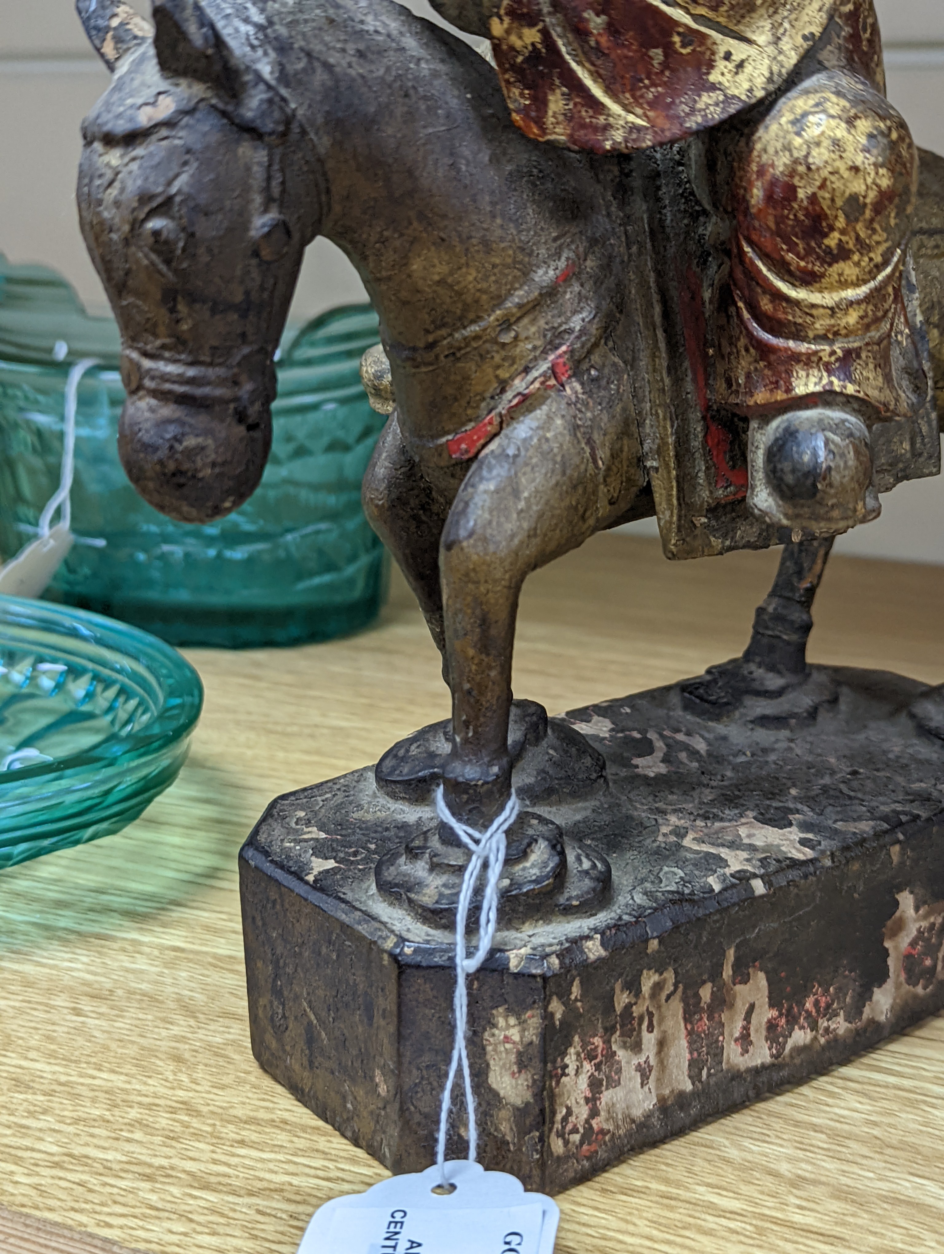 An 18th/19th century Chinese lacquered wood group of an official riding a horse, 30cm